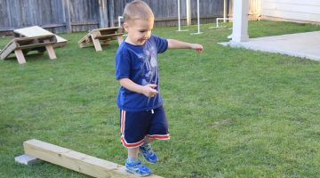 Child walking on a plank